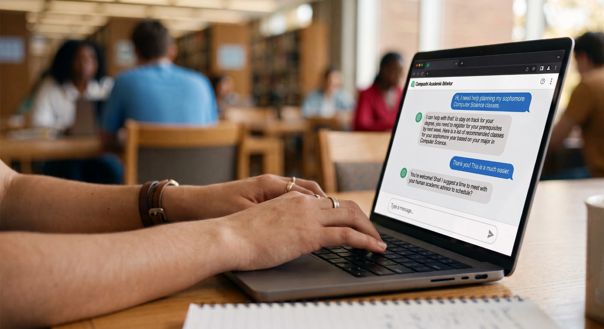 Close-up of a student typing on a laptop inside a library. The screen displays a chat conversation with a "Campus AI Academic Advisor" where the student asks for help planning sophomore Computer Science classes, and the bot provides recommended prerequisites and offers to schedule a session with a human advisor.